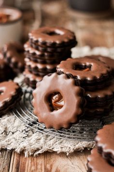 chocolate donuts on a cooling rack with frosting