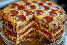 a pizza cake is cut in half and ready to be eaten