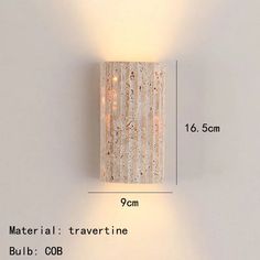 a white wall light with two lights on it's side and measurements for each lamp