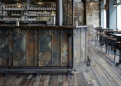 an old bar with wooden floors and bars