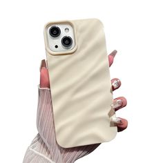 a woman holding up an iphone case with her finger on the back of her hand