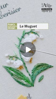 the video is showing how to make an embroidered flower