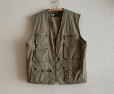 Men's Vest Cargo Style Vest Beige Cotton Blend Gentlemen's Waistcoat Fisherman Hunter Vest Multi Pocket Zip up Measurements (lying flat): Length: 27.5"/ 70 cm Pit to pit: 24.5"/ 62 cm Condition: Great Vintage Condition Material: 65%polyester,35%cotton N.B. Color may slightly differ from picture Please check measurements to insure a proper fit. Remember to allow yourself some extra room for movement. You can compare these with something from your closet that fits you well. SHIPPING * I ship world Cargo Vest, Style Vest, Mens Vests, Extra Rooms, Cargo Style, Men's Vest, Vest Outfits, Mens Vest, Hoodie Design