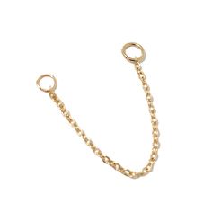 This versatile single cable chain earring jacket is composed of 14K solid gold. Finished with two jump rings to be threaded through your earring posts so that you can wear it more ways than one. The sample images showing the chain worn on the white rubber ear mold are 1.5" in length. Whereas the sample images showing the chain worn on the human ear are 2" in length. NOTE: This item is sold as a SINGLE piece, not a pair. If you would like to purchase a pair, kindly select 2 under the "Quantity" d Earring Jacket, Chain Earring, Multiple Piercings, Hoop Charms, Earring Jackets, Solid Gold Earrings, Gold Earring, Fine Jewelry Designers, Chain Earrings