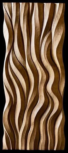 an art piece made out of wood with wavy lines on it