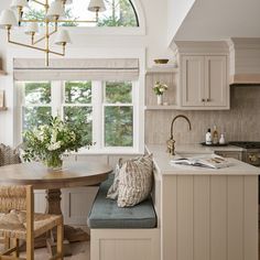 a kitchen with a table and chairs in it