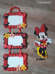 three frames with mickey mouse and minnie mouse pictures hanging from them on a wooden floor