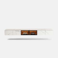 the sideboard has two doors and is white marble