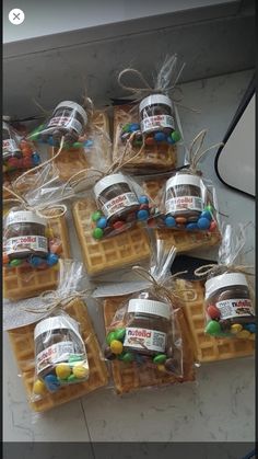 several waffles wrapped in plastic with candy on them