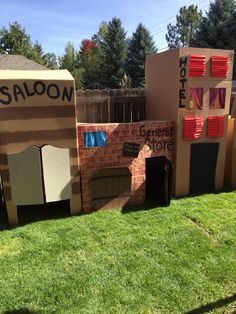 an outdoor dog house made out of cardboard