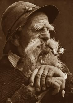 an old man with a pipe in his mouth