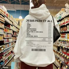 the back of a person wearing a hoodie that reads jesus paid it all