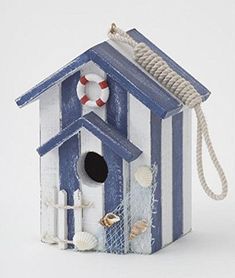 a blue and white birdhouse with an american flag on it