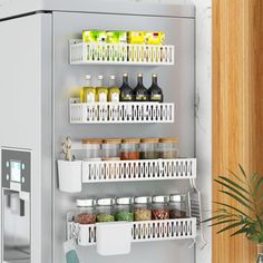 a refrigerator with shelves filled with food and drinks next to a potted green plant