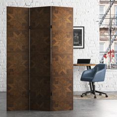 the room divider is made out of wood and has an intricate pattern on it