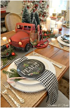 a christmas table setting with an old truck