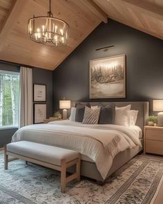 a large bed sitting under a wooden ceiling