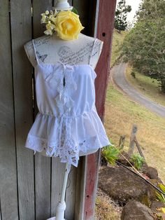 "a white cotton and linen top  featuring Battenberg lace and fine cotton crochet lace ties at the front adjustable shoestring straps  SIZE ~ approximately M / Lg ~ bust when fastened is 95 cm / 37.5\" mannequin is a size small  gentle wash" White Cotton Lace Summer Tops, Bohemian Camisole With Lace Trim For Vacation, Bohemian Lace Trim Camisole For Vacation, Bohemian Tops With Lace Trim And Spaghetti Straps, Casual Cotton Lace Top For Summer, Summer Cotton Lace Tops With Crochet Trim, Bohemian Camisole For Festivals, White Lace Camisole Top For Beach, White Cotton Lace Top For Summer