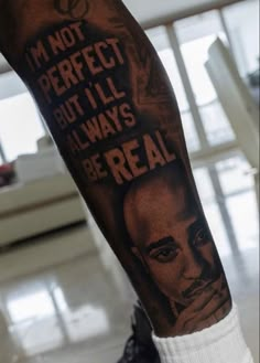 a man's leg with a quote on it that says i'm not perfect but i'll always be real