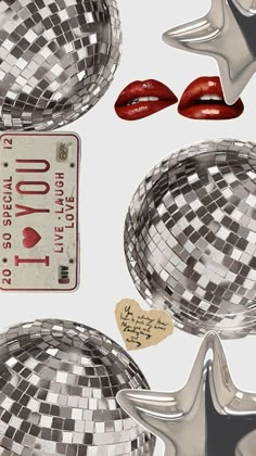 a mirror ball with some red lipstick on it and a sign that says i love you