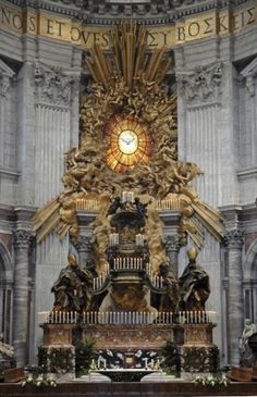 an ornate alter with statues and a stained glass window