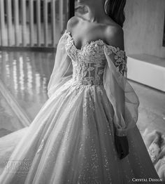 black and white photo of a woman in a ball gown looking off to the side