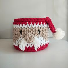 a crocheted santa claus basket with a pom - pom