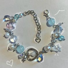 Handmade pastel blue coquette inspired bracelet made with care :3 -size can be adjusted (free) #handmadejewelry #beadedbracelet #handmade #coquette #pastelblue #beadeditems #handcrafted #jewellry Blue Accessories Aesthetic, Blue Charm Bracelets For Jewelry Making, Blue Jewelry Aesthetic, Cute Handmade Blue Charm Bracelet, Adjustable Blue Charm Bracelet With Heart Beads, Coquette Charm Bracelet, Handmade Blue Dangle Charm Bracelet, Handmade Light Blue Aquamarine Bracelets, Diy Charm Bracelet