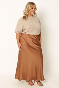 DETAILS
This midi skirt will be your go-to for everyday style. Crafted from a soft satin fabric, it features an elasticised waistband and a pull on design for fuss-free dressing. The bronze color is a timeless classic that you'll reach for again and again.

midi length
elasticised waist
pull on design
soft satin feel
unlined
material - 97% polyester / 3% spandex









SIZING

model 1 is 5' 7" and wears a Size XS

model 1 stats: bust - 32", waist - 25", hips - 37"
model 2 is 5' 1" and wears a Size XL
model 2 stats: bust - 39", waist - 34", hips - 48"












GARMENT CARE

cold hand wash separately Tan Satin Skirt, Bronze Satin Skirt, Brown Slip Skirt Plus, Brown Satin Midi Skirt, Brown Non-stretch Midi Skirt, Satin Midi Skirt, Clothing Details, Style Mistakes, Timeless Classic