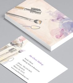 the business card is designed to look like it has makeup brushes on it