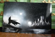 a painting of a batman flying over a city at night with the moon in the sky