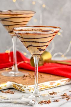 two martini glasses filled with chocolate and caramel