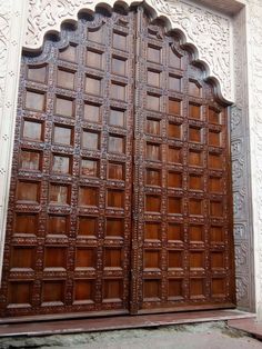 an ornate wooden door with intricate carvings on it