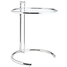 a chrome plate with a metal stand on it's legs and a round glass shelf