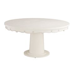 a white cake plate with scalloped edges