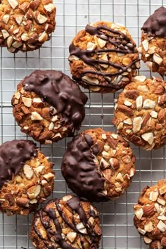 cookies with chocolate frosting and nuts on a cooling rack