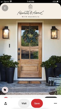 the front door of a home with potted plants on it and an instagram button