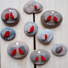 some rocks with hearts and names painted on them