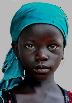 a woman with a blue turban on her head