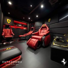 the interior of a car showroom with red leather seats and ferrari logo decals