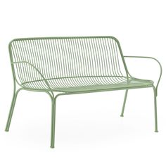 a green metal bench sitting on top of a white floor