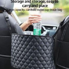 a woman holding a water bottle in her car back seat storage bag with the words storage and storage, easy to carry and place