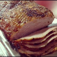 a piece of meat sitting on top of a white plate