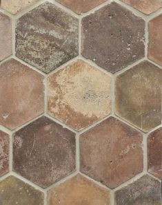 an image of a tile floor that looks like hexagonals in different colors