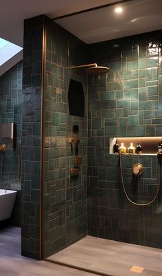 a bathroom with green tiled walls and floor