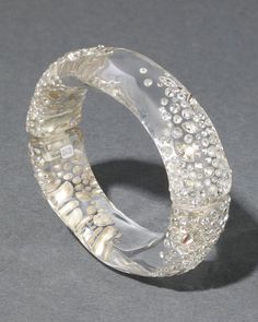 Inspired by archival Alexis Bittar classics, redesigned with a modern twist. This hand-sculpted liquid clear Lucite hinged bracelet is hand-polished for a reflective watery luster and dusted with inlaid custom cut crystals that shine from every angle. Rhodium tone plated brass, Lucite, crystal Lucite is hand-carved and hand-polished in Brooklyn, NY Candle Lighters, Beautiful Gift Wrapping, Ring Watch, Hinged Bracelet, Alexis Bittar, Bracelet Stack, Hat Hairstyles, Mules Shoes, Earring Necklace