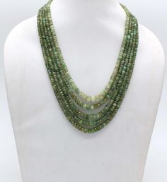 AAA Quality Natural Faceted Heishi 5 Strand Emerald Necklace With Adjustable Tassel Cord(Sarafa), 5 Strand Necklace, Natural Emerald Necklace, 18 Inch Long Specifics: Material : Gemstone Length: 18 Inch Necklace Stone :  Natural Emerald Gemstone Stone Size :  5.5 mm X 6.9 mm -- 7.8 mm X 9.6 mm Style:  Faceted Beaded Necklace Color: Green We deal in all kind of semi precious,precious beads ,Gemstones and Jewelry (in every shape and size ) as per demand. Here, you get a direct access to an exclusi Cheap Green Multi-strand Necklaces, Luxury Green Single Strand Beaded Necklace, Luxury Green Multi-strand Beaded Necklaces, Luxury Double Strand Green Necklace, Necklace Emerald, Precious Beads, Gold Jewelry Earrings, Emerald Necklace, Gold Necklace Designs