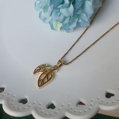 DESCRIPTION: This dainty gold leaf necklace features a CZ tropical leaf pendant on a satellite chain, inspired by nature. A minimalist and elegant plant design, it's a perfect gift for her and ideal for everyday wear. BEST FEATURES: Stunning gold leaf design with sparkling CZ accents. Delicate satellite chain adds a modern touch. Lightweight and comfortable for all-day wear. Nature-inspired, perfect for plant lovers. Versatile for layering or wearing alone for a chic look. ADVANTAGES: Eye-catchi Gold Leaf Necklace, Plant Jewelry, Customer Gifts, Tropical Leaf, Necklace Minimalist, Leaf Necklace, Plant Design, Leaf Pendant, Perfect Gift For Her