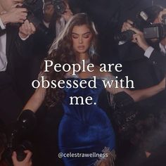 a woman in a blue dress surrounded by photographers and people with cameras around her text reads, people are obsessed with me