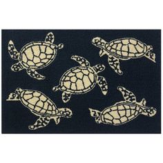 four turtle rugs in various sizes and colors on a black background with white trim